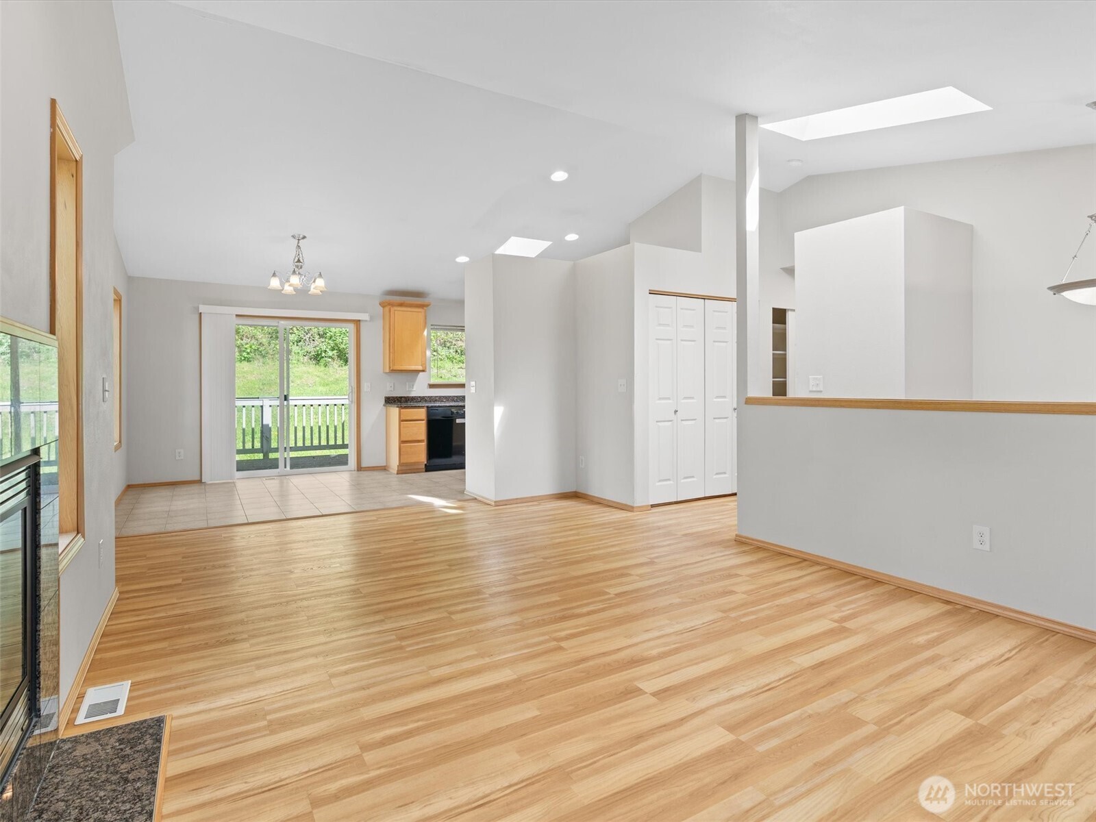 5062 23rd Avenue Southwest Seattle, WA 98106 - Photo 9 of 39 a view of empty room with wooden floor and fan