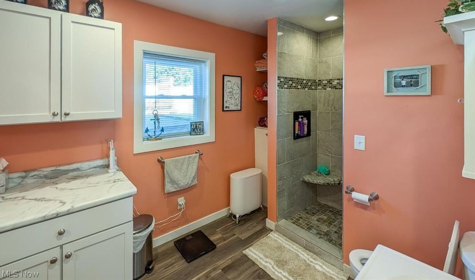 41 Poplar Street Huron, OH 44839 - Photo 15 of 37 Bathroom featuring vanity, a walk in shower, and wood style flooring