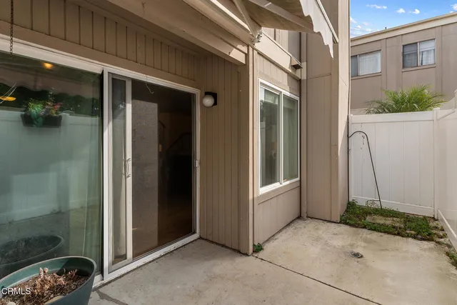 a view of a door in front of a house