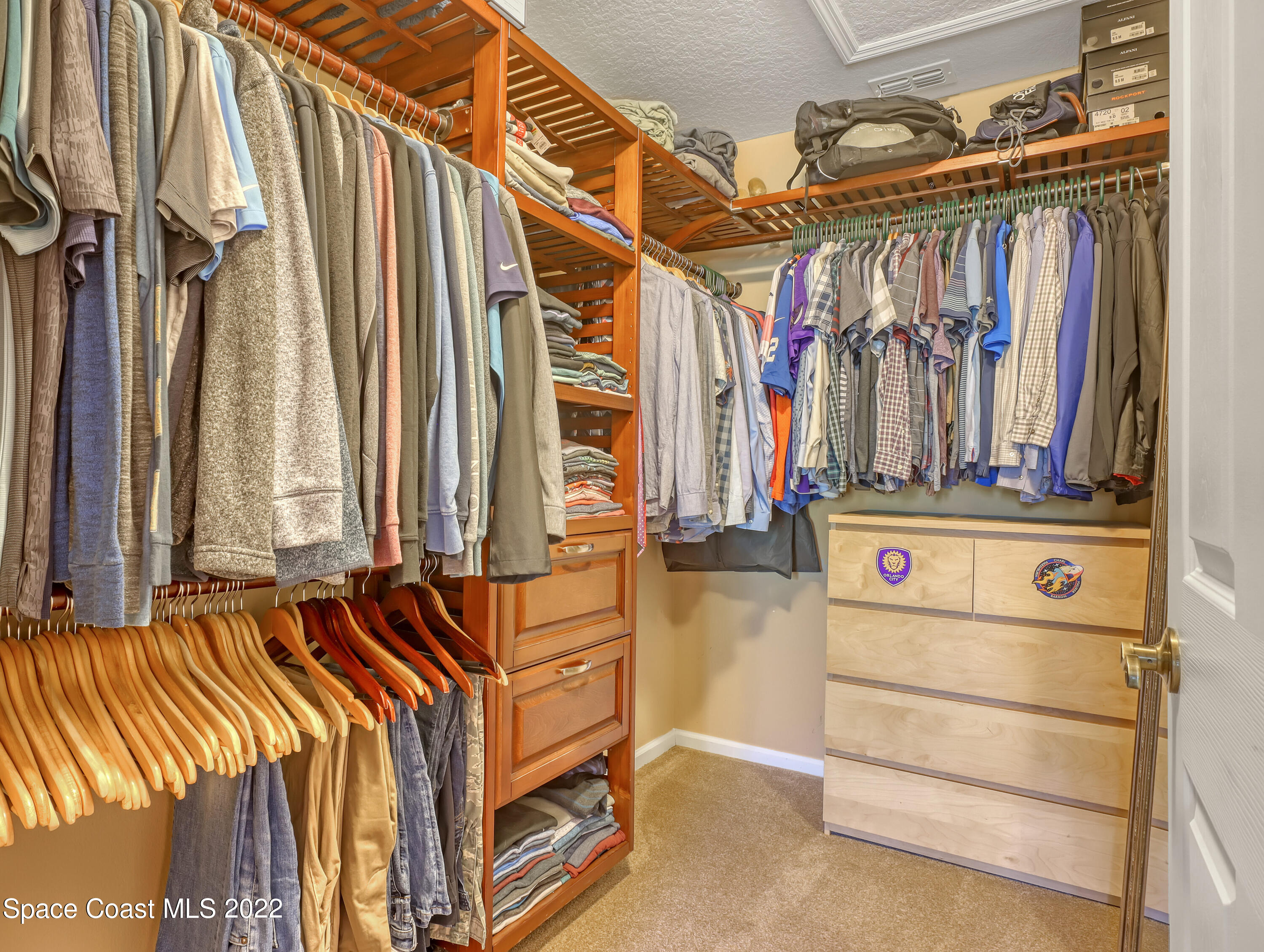 4077 Meander Place Rockledge, FL 32955 - Photo 10 of 24 a view of walk in closet with clothes