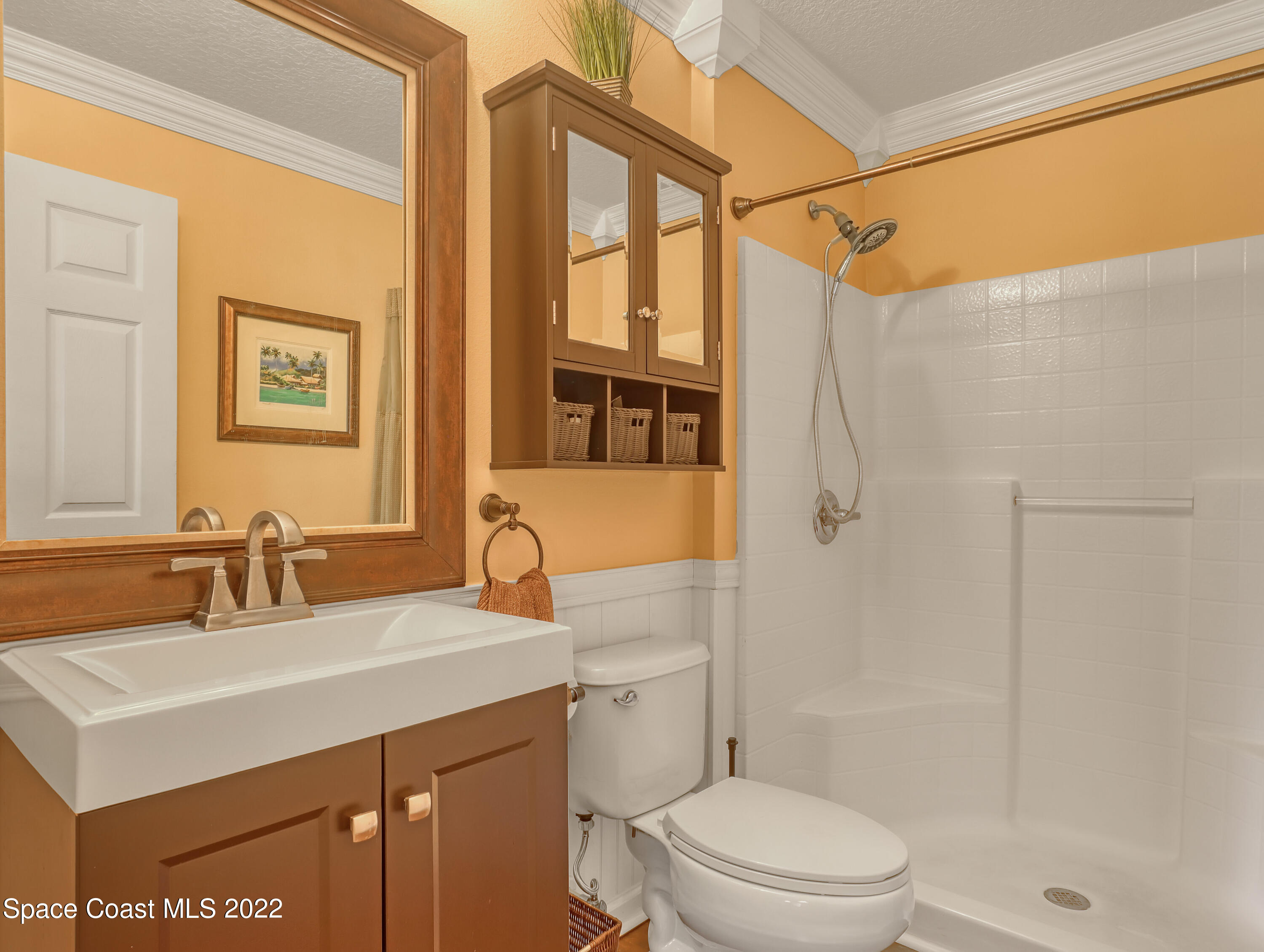 4077 Meander Place Rockledge, FL 32955 - Photo 11 of 24 a bathroom with a sink toilet and shower