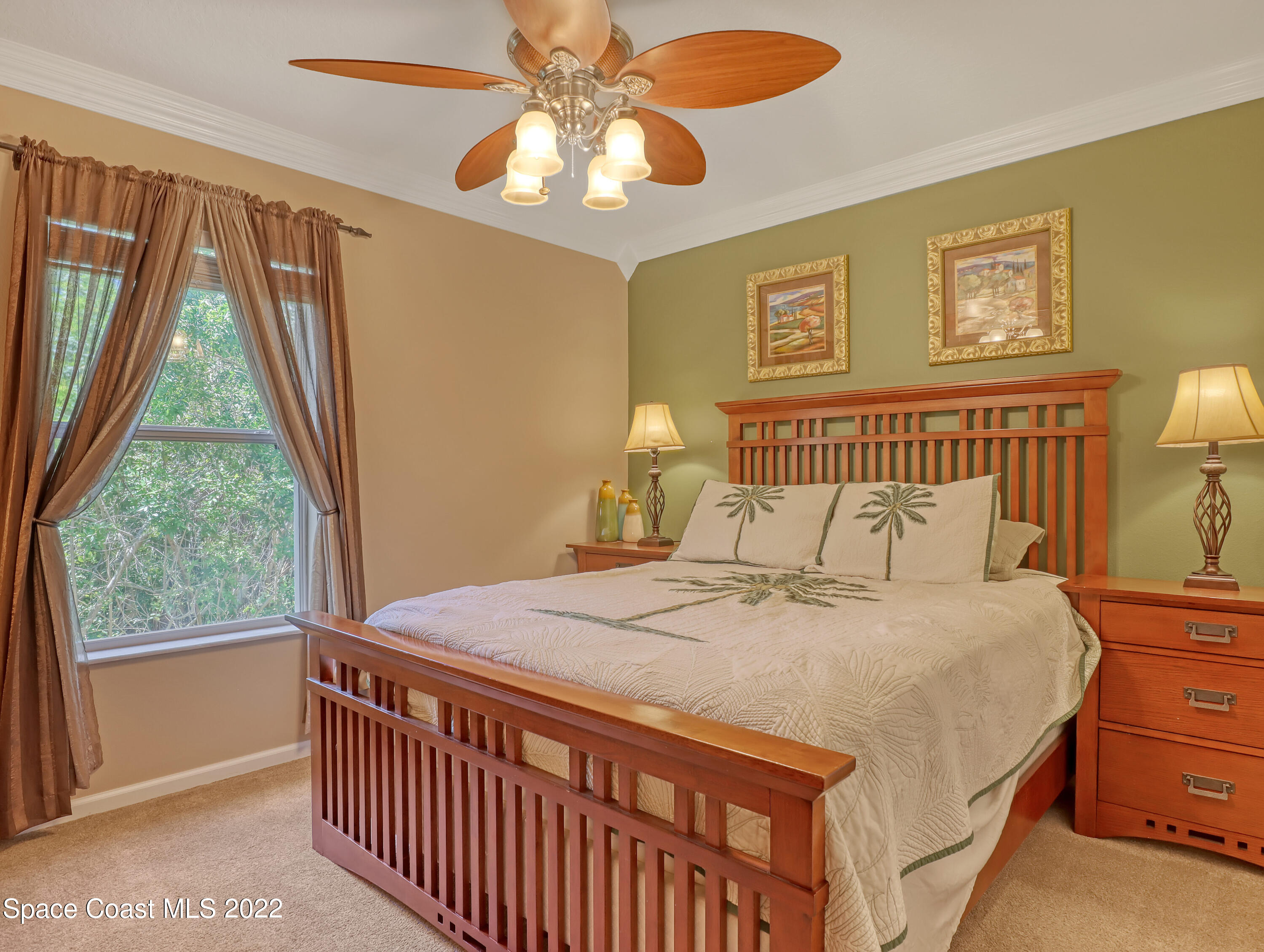4077 Meander Place Rockledge, FL 32955 - Photo 12 of 24 a bedroom with a bed and a window