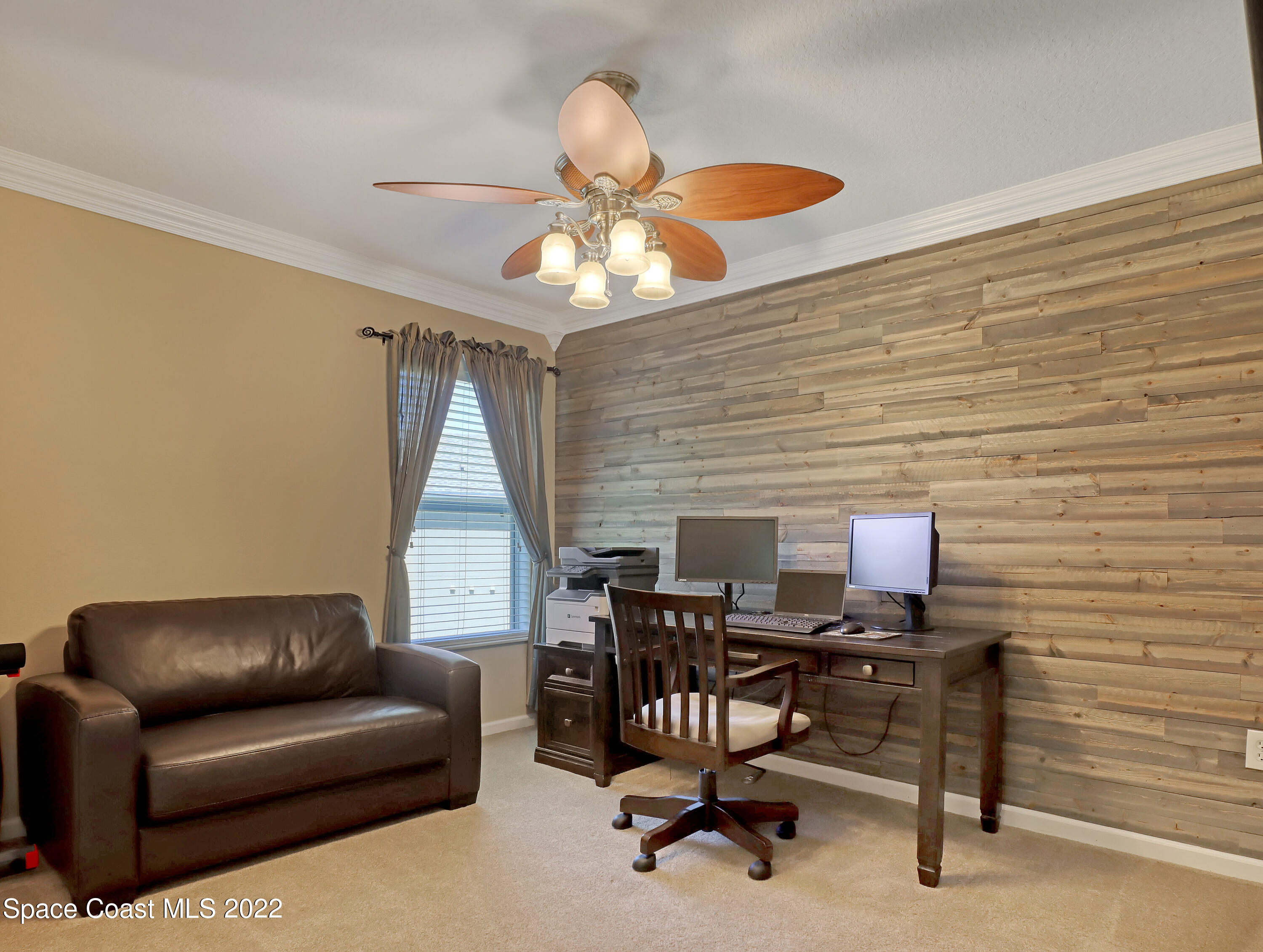 4077 Meander Place Rockledge, FL 32955 - Photo 14 of 24 a workspace with furniture and a window