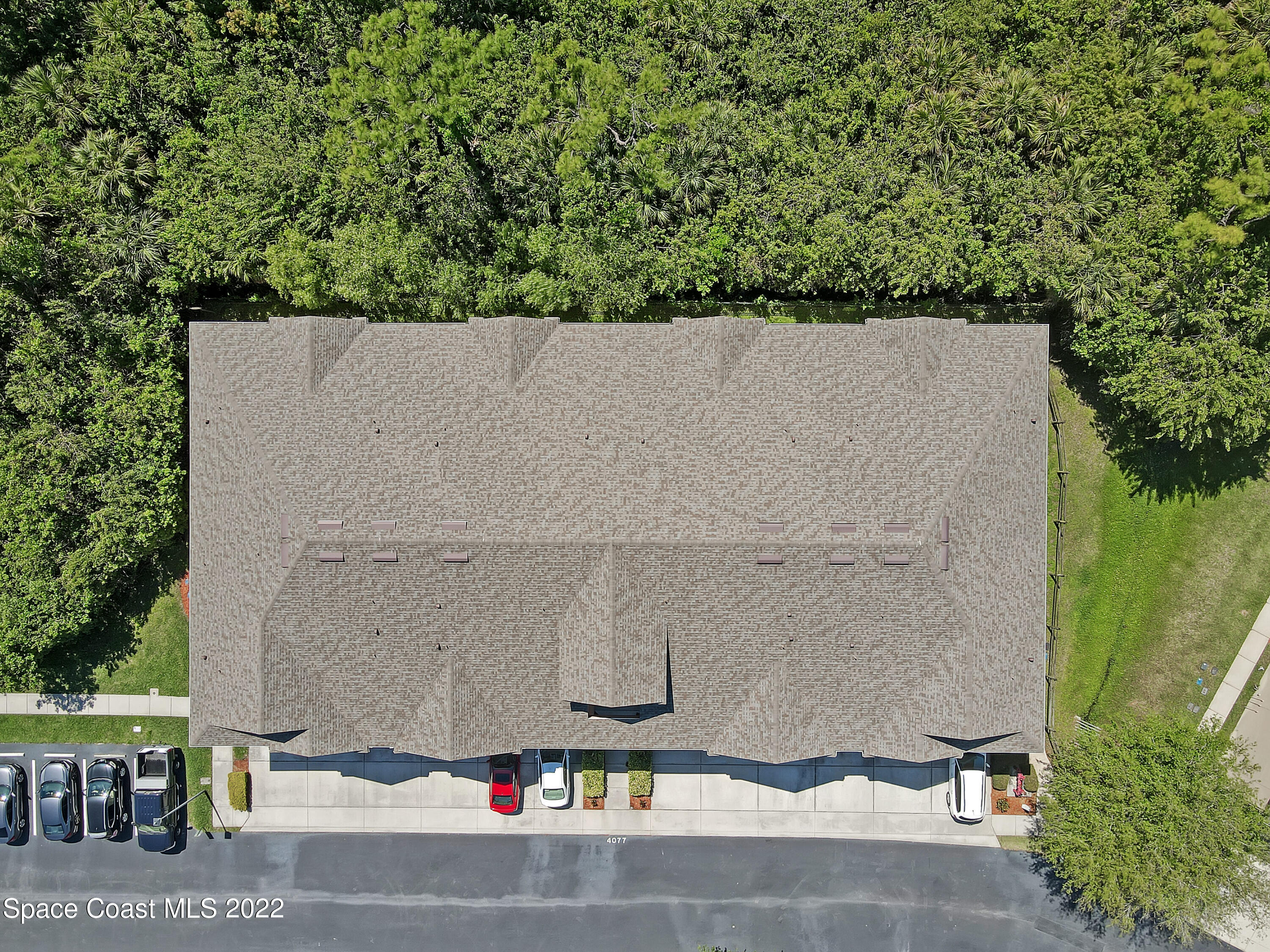 4077 Meander Place Rockledge, FL 32955 - Photo 18 of 24 an aerial view of residential house with outdoor space and trees around