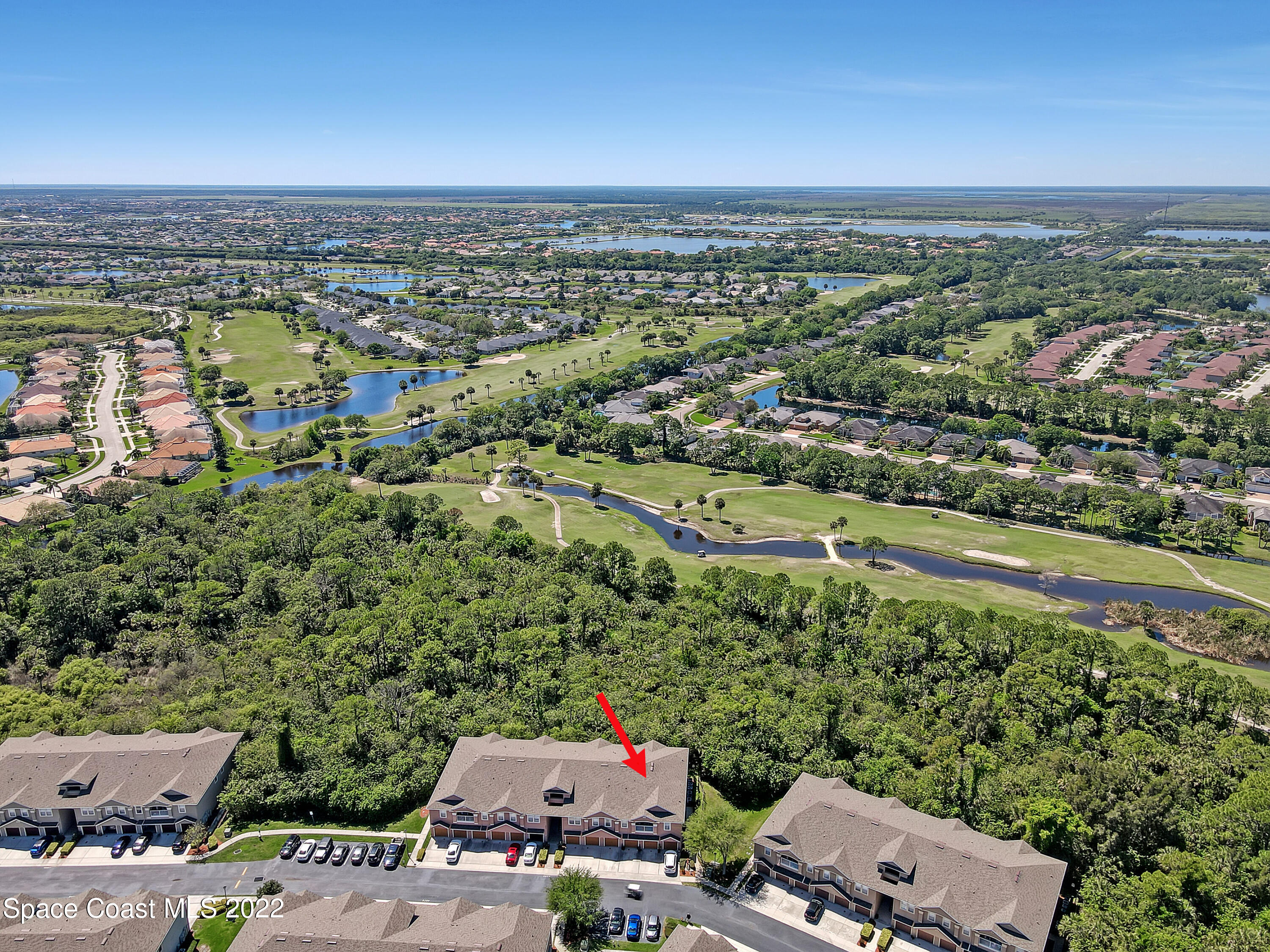 4077 Meander Place Rockledge, FL 32955 - Photo 21 of 24 an aerial view of a city with lots of residential buildings