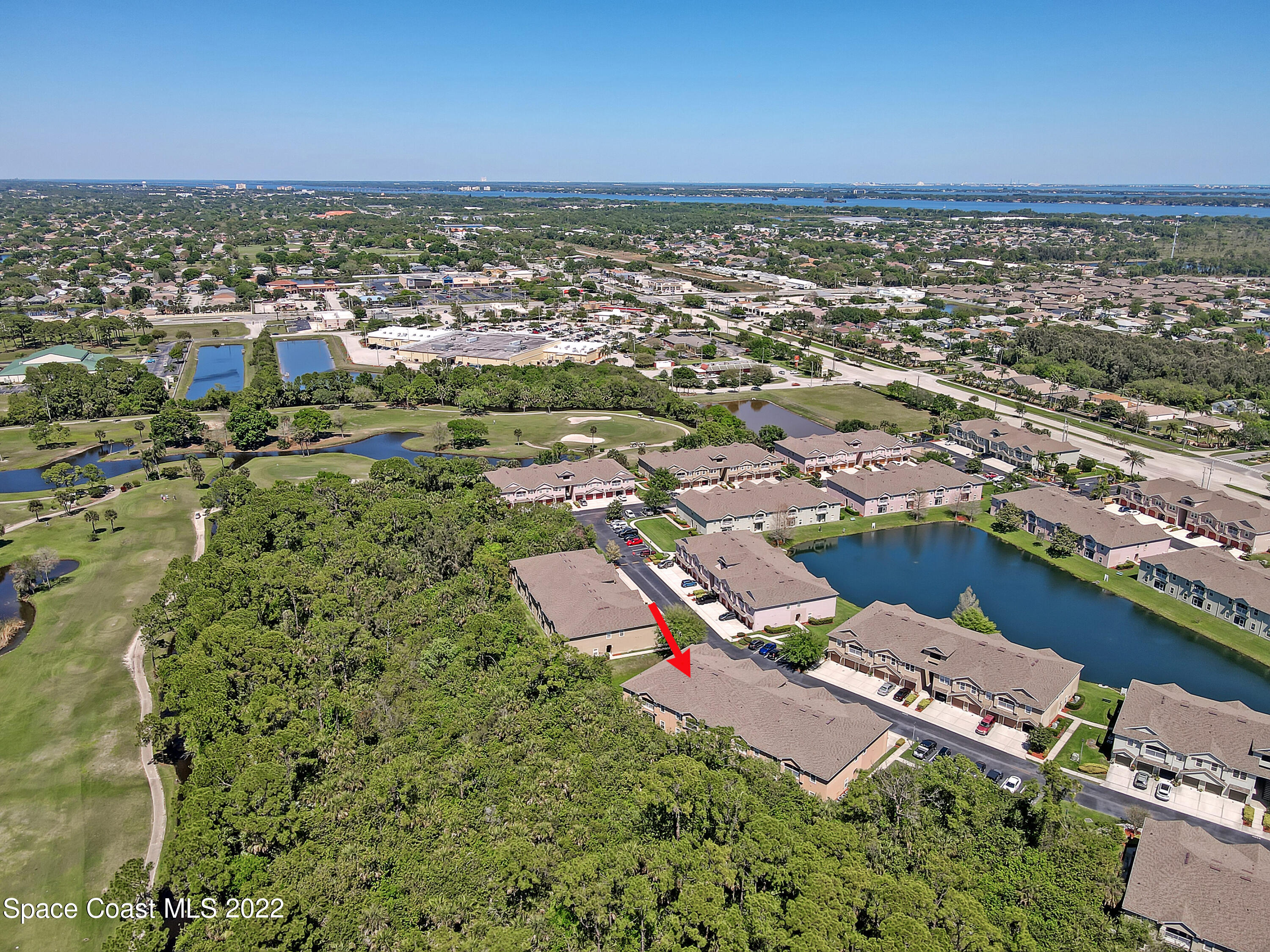 4077 Meander Place Rockledge, FL 32955 - Photo 22 of 24 an aerial view of residential building and lake