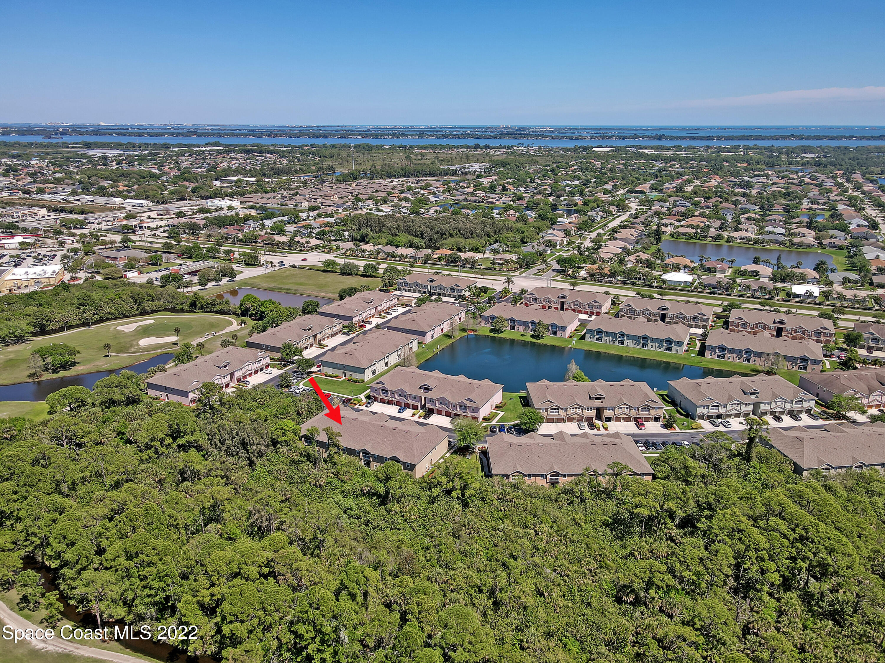 4077 Meander Place Rockledge, FL 32955 - Photo 23 of 24 an aerial view of a city with lots of residential buildings