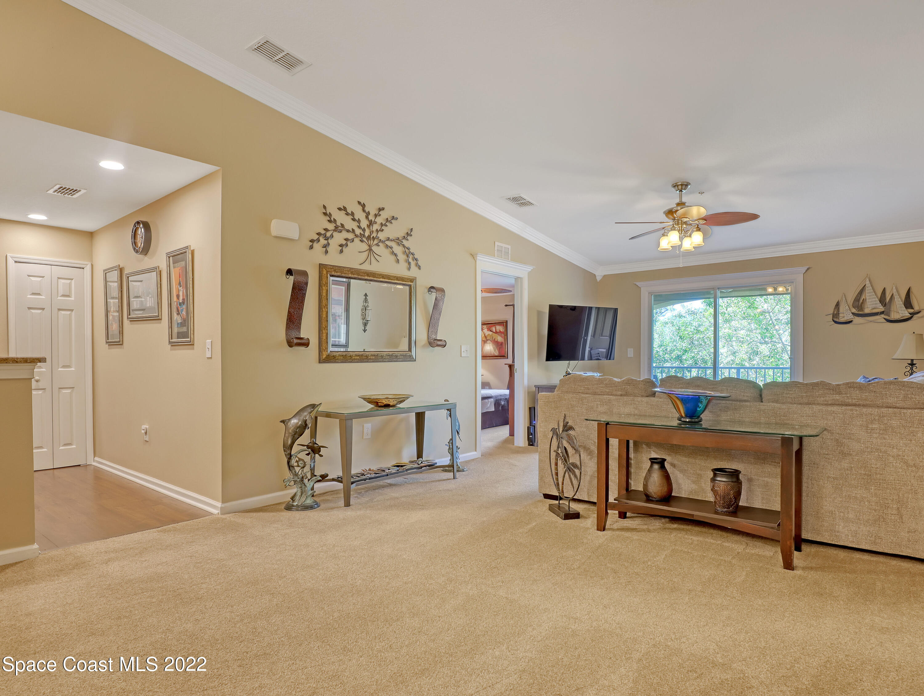 4077 Meander Place Rockledge, FL 32955 - Photo 6 of 24 a view of a livingroom with furniture and a flat screen tv