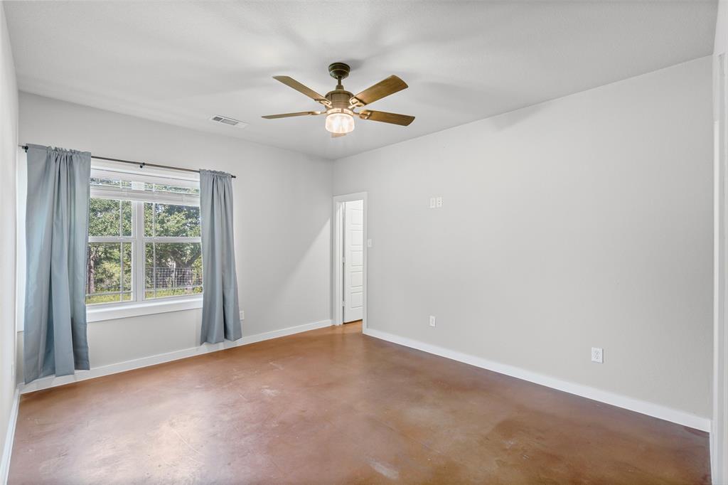 166 South Bronco Court Springtown, TX 76082 - Photo 15 of 40 a view of an empty room with a window