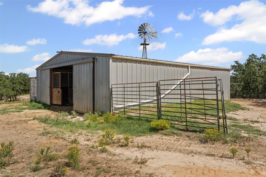 166 South Bronco Court Springtown, TX 76082 - Photo 25 of 40 a view of a backyard with pathway