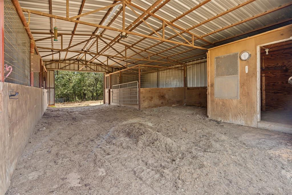 166 South Bronco Court Springtown, TX 76082 - Photo 26 of 40 a view of a room with wooden walls