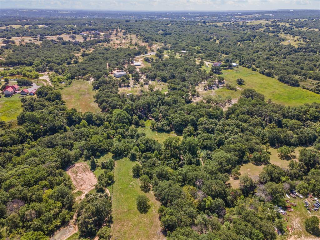 166 South Bronco Court Springtown, TX 76082 - Photo 28 of 40 an aerial view of residential houses with outdoor space and trees