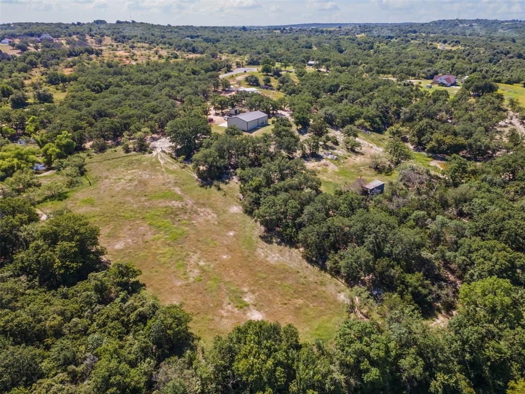 166 South Bronco Court Springtown, TX 76082 - Photo 30 of 40 an aerial view of residential houses with outdoor space and trees