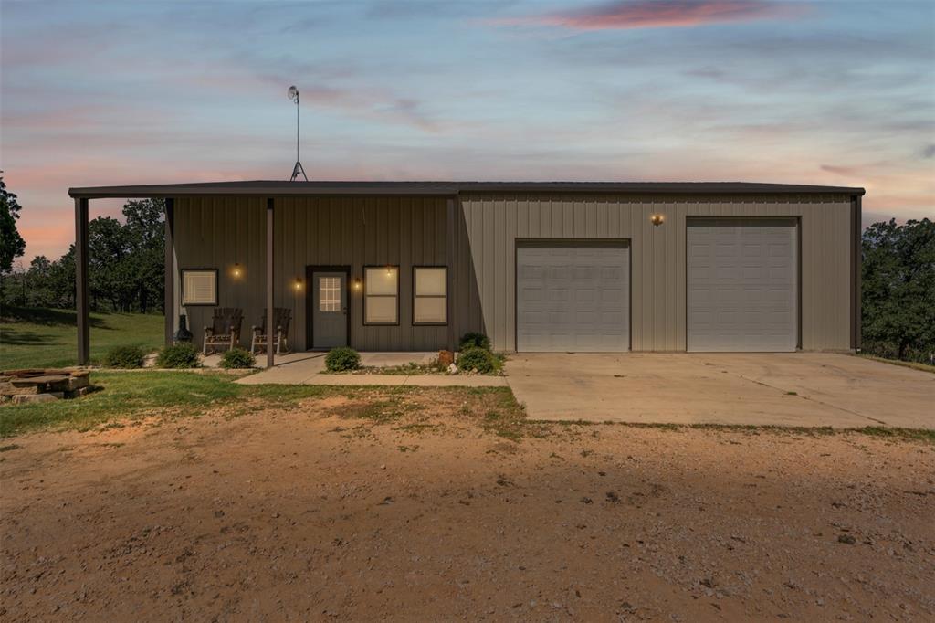166 South Bronco Court Springtown, TX 76082 - Photo 3 of 40 a view of a house with a porch