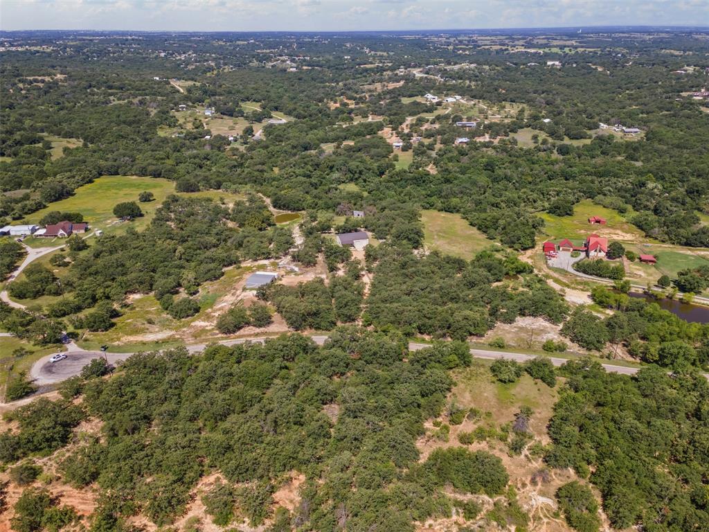 166 South Bronco Court Springtown, TX 76082 - Photo 33 of 40 an aerial view of residential houses with city view