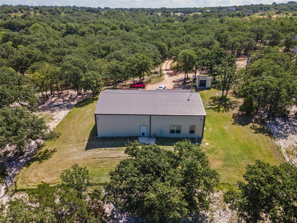 166 South Bronco Court Springtown, TX 76082 - Photo 4 of 40 an aerial view of a house