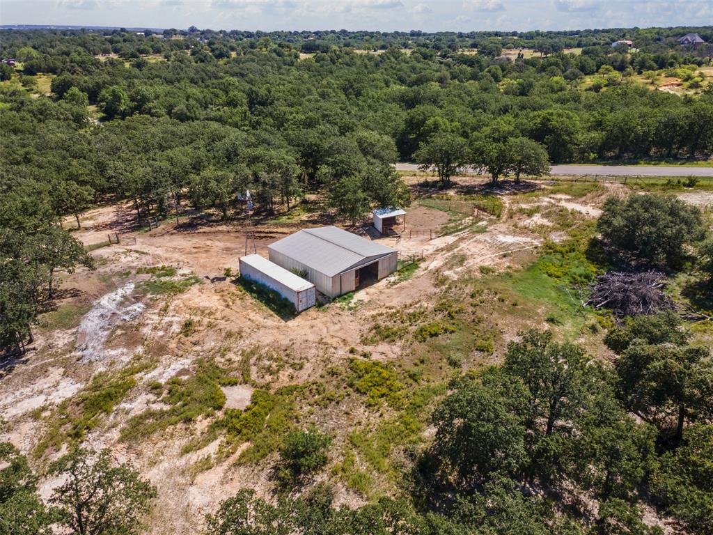 166 South Bronco Court Springtown, TX 76082 - Photo 6 of 40 a view of a yard with a barn