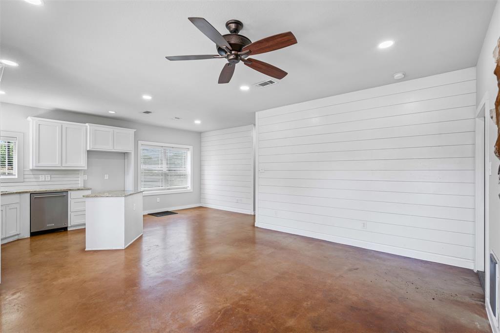166 South Bronco Court Springtown, TX 76082 - Photo 9 of 40 a view of empty room with kitchen appliances and sink