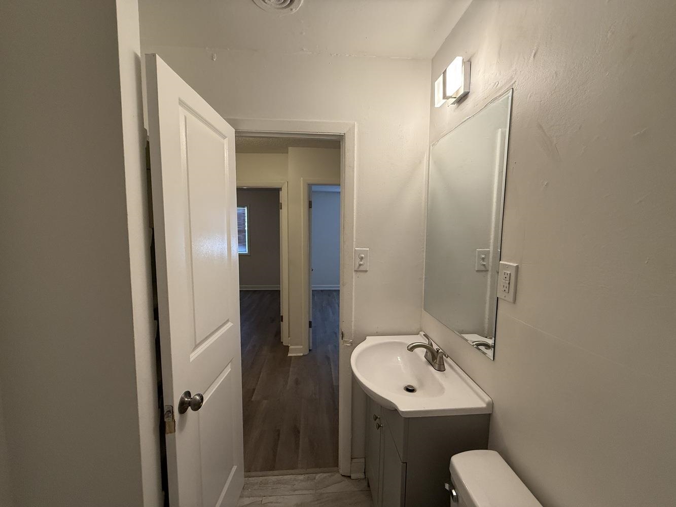 4900 Berta Road Memphis, TN 38109 - Photo 20 of 26 a bathroom with a sink a toilet and shower