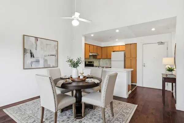 a view of a kitchen with a dishwasher cabinets and wooden floor