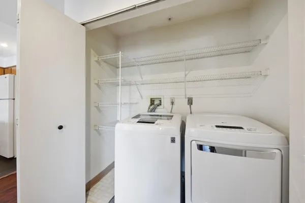 a view of room with wooden floor and stairs
