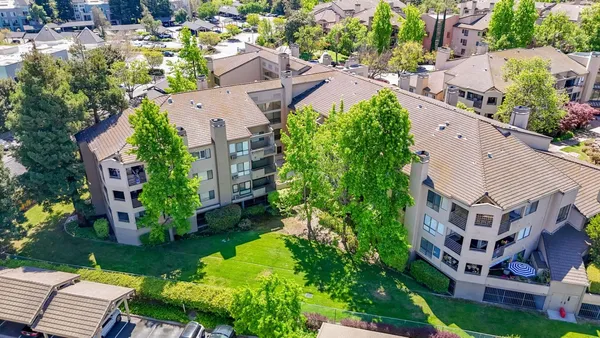 an aerial view of a swimming pool yard and outdoor space