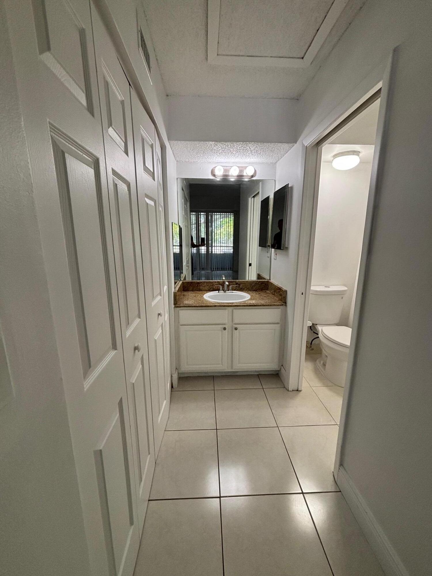 811 Lyons Road, Unit 20203 Coconut Creek, FL 33063 - Photo 5 of 12 IMG_7264