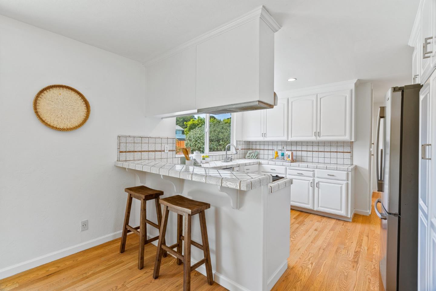 829 Monterey Avenue Capitola, CA 95010 - Photo 15 of 59 a kitchen with a sink cabinets and wooden floor