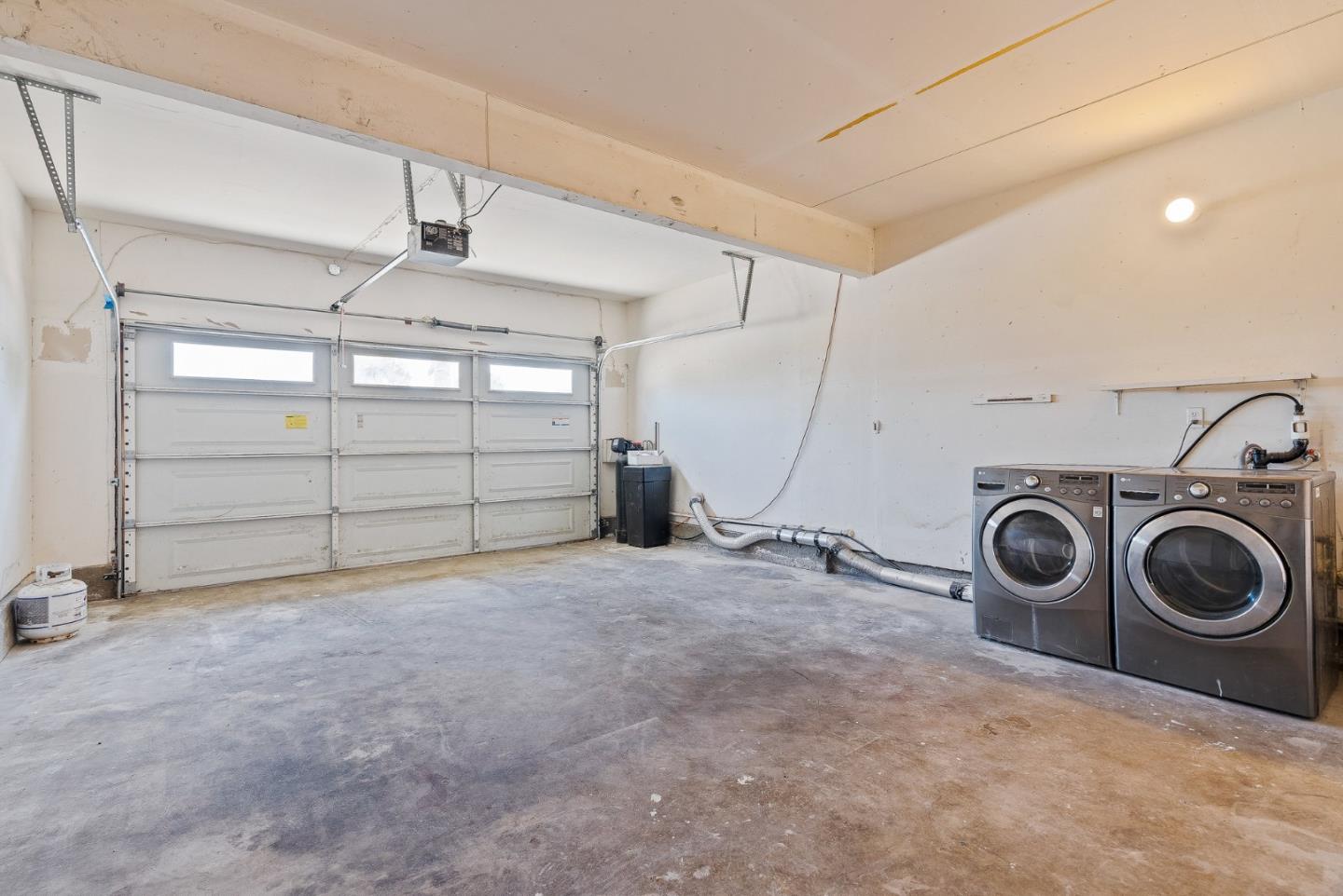 829 Monterey Avenue Capitola, CA 95010 - Photo 20 of 59 a view of a storage & utility room with washer and dryer