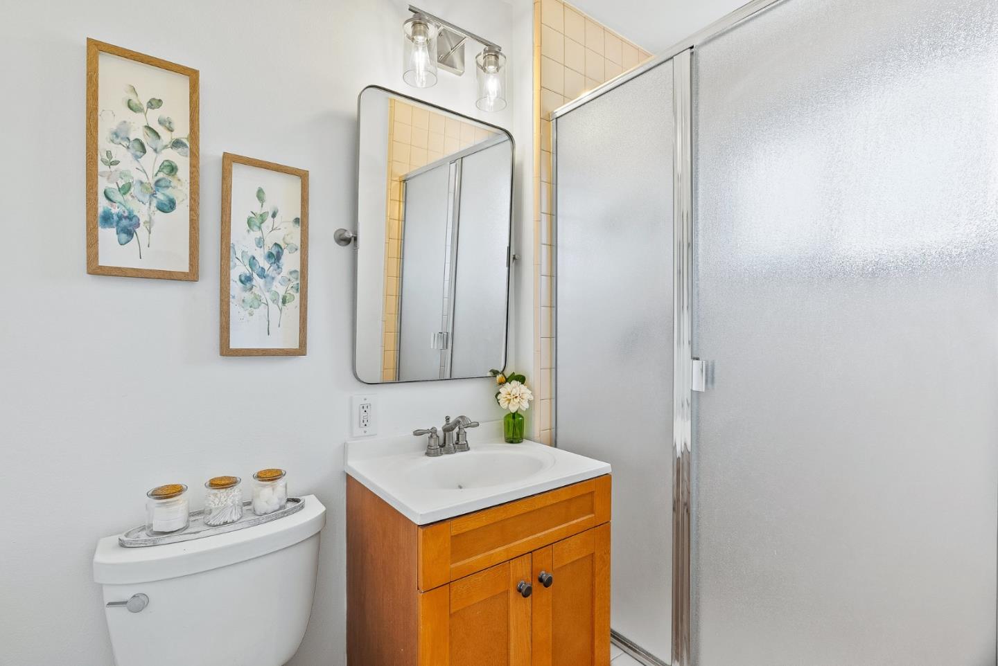 829 Monterey Avenue Capitola, CA 95010 - Photo 22 of 59 a bathroom with a sink vanity mirror and toilet