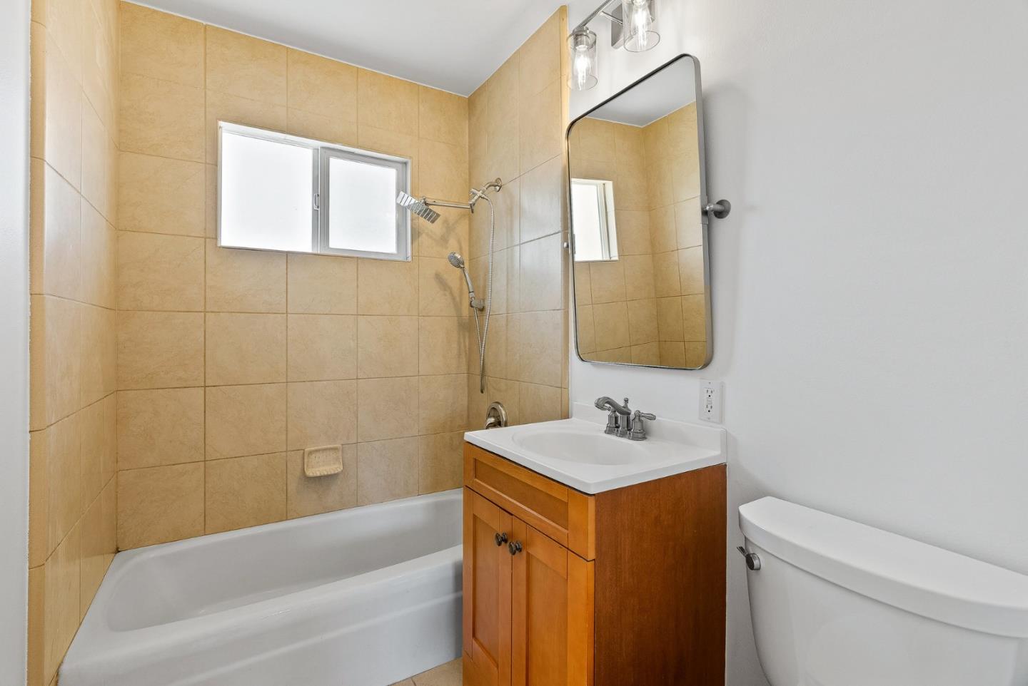 829 Monterey Avenue Capitola, CA 95010 - Photo 26 of 59 a bathroom with a sink a toilet and bathtub