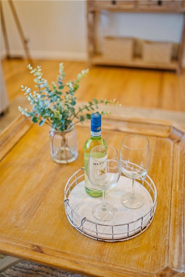 829 Monterey Avenue Capitola, CA 95010 - Photo 35 of 59 a water view with a dining table chairs and a chandelier