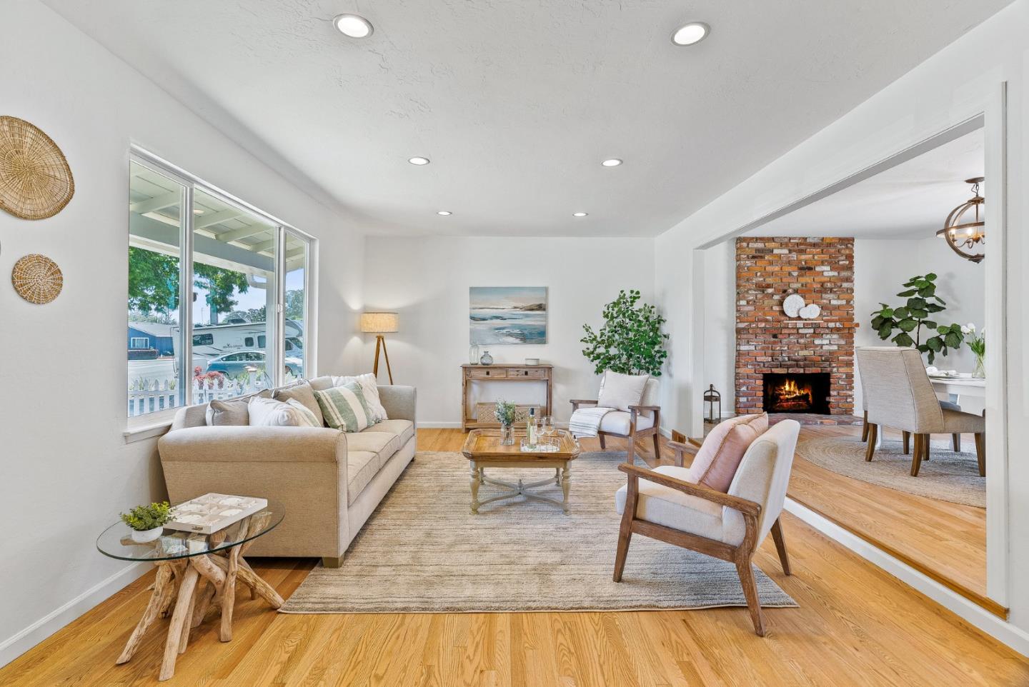 829 Monterey Avenue Capitola, CA 95010 - Photo 8 of 59 a living room with fireplace furniture and a large window
