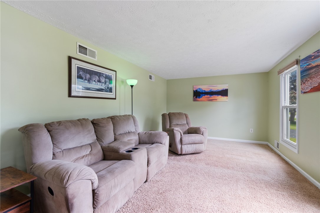 25 Spring Tree Lane Greece, NY 14612 - Photo 18 of 40 The front living room- looks out to the COVERED FR