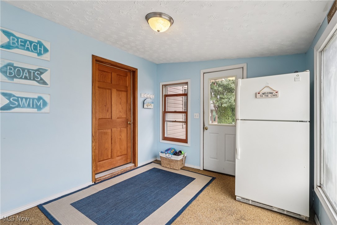 337 Cedar Point Road Sandusky, OH 44870 - Photo 15 of 50 Doorway with a textured ceiling