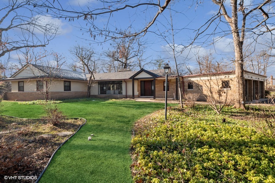a house with garden in front of it