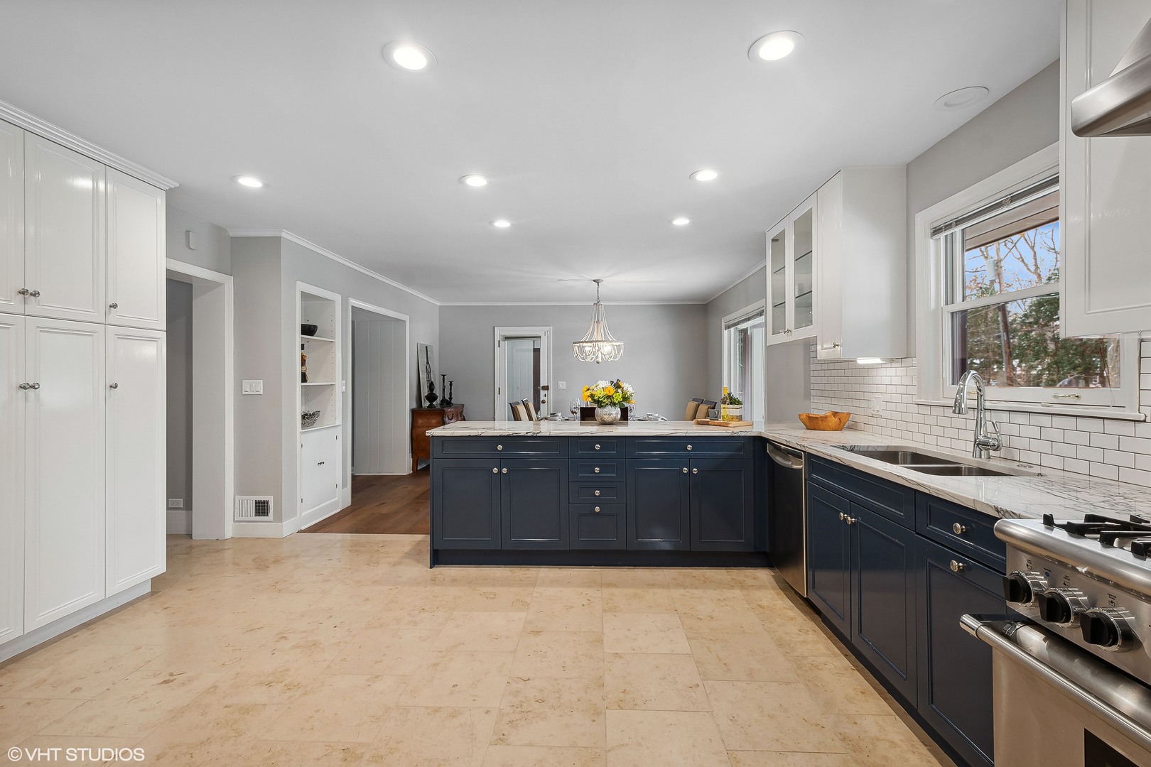 526 Coronet Road Glenview, IL 60025 - Photo 12 of 23 a large kitchen with stainless steel appliances granite countertop a lot of counter space and wooden floors