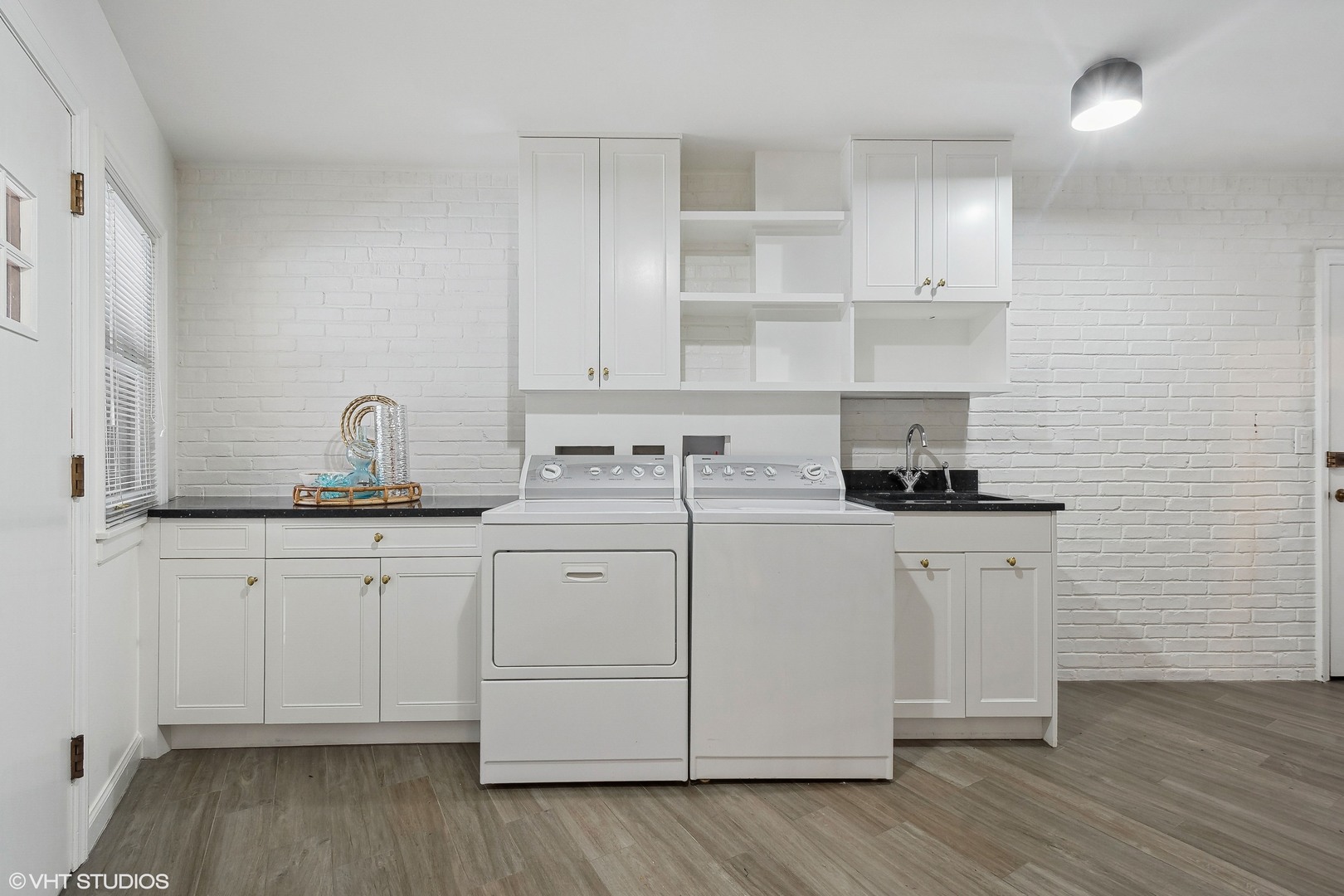 526 Coronet Road Glenview, IL 60025 - Photo 15 of 23 a kitchen with white cabinets and sink