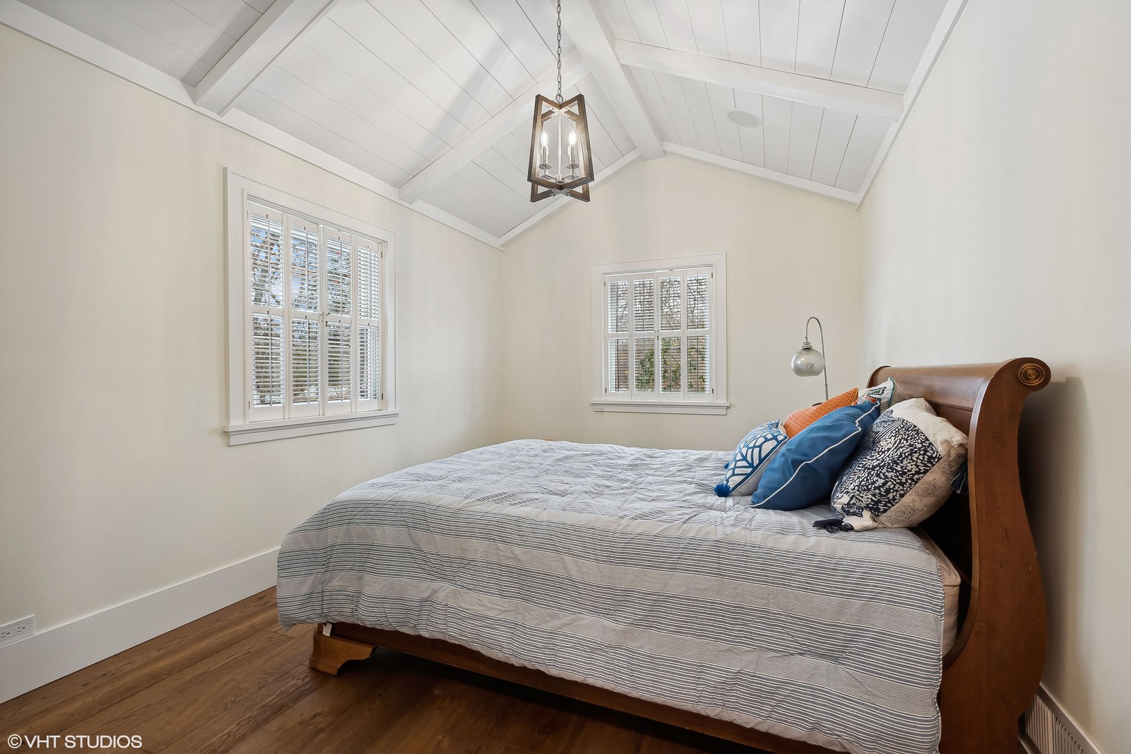 526 Coronet Road Glenview, IL 60025 - Photo 20 of 23 a bedroom with a bed and wooden floor