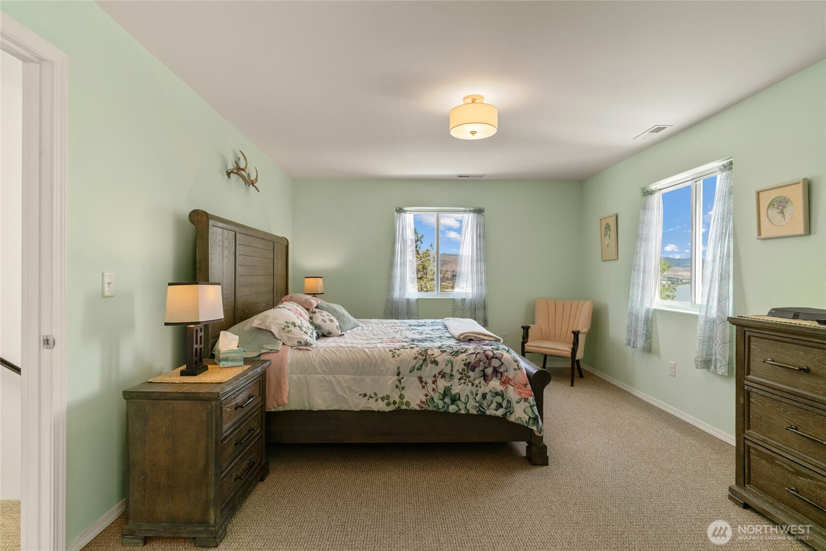 165 Granite Falls Road Chelan, WA 98816 - Photo 9 of 27 a bedroom with a bed and wooden floor