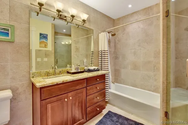 a living room with furniture fireplace and a flat screen tv
