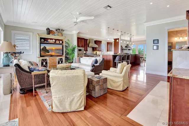 a view of a dining room with furniture kitchen and wooden floor