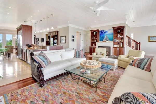 a kitchen with stainless steel appliances granite countertop lots of counter top space and wooden floor