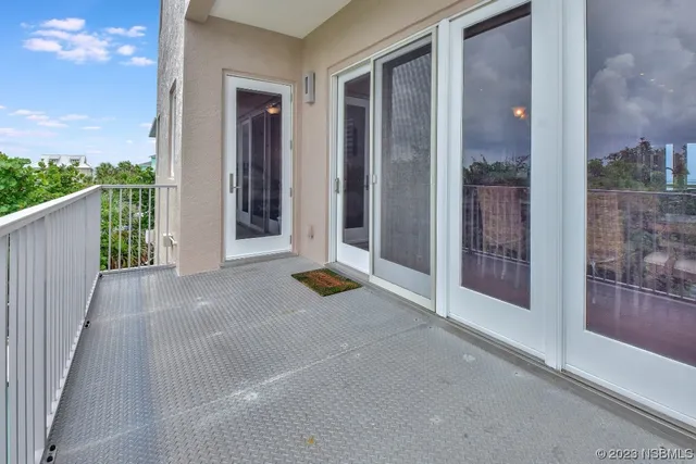 a spacious bedroom with a bed a couch and a window