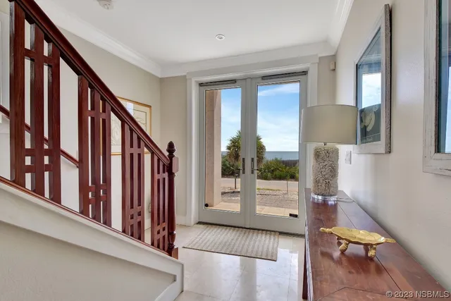 a living room with furniture a flat screen tv and a large window