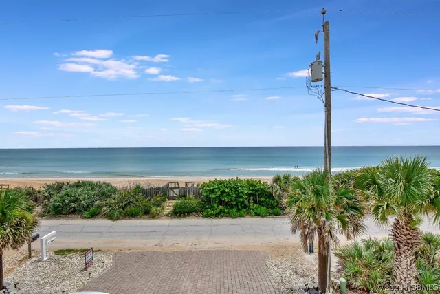 a view of swimming pool having outdoor seating