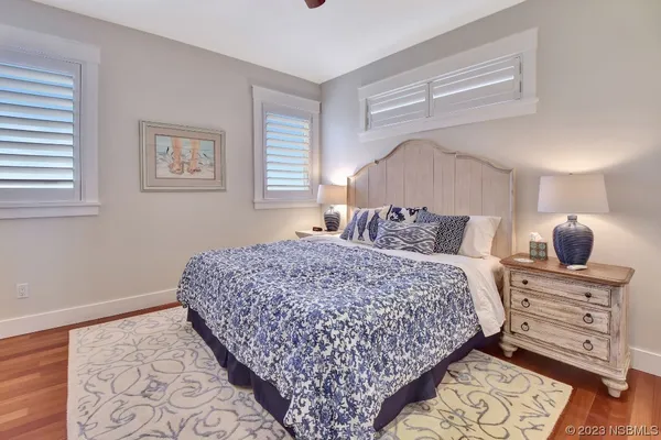 an aerial view of residential houses with yard