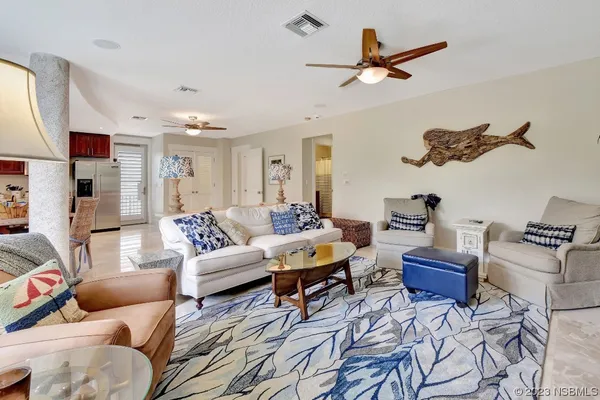 a bedroom with two beds and a window