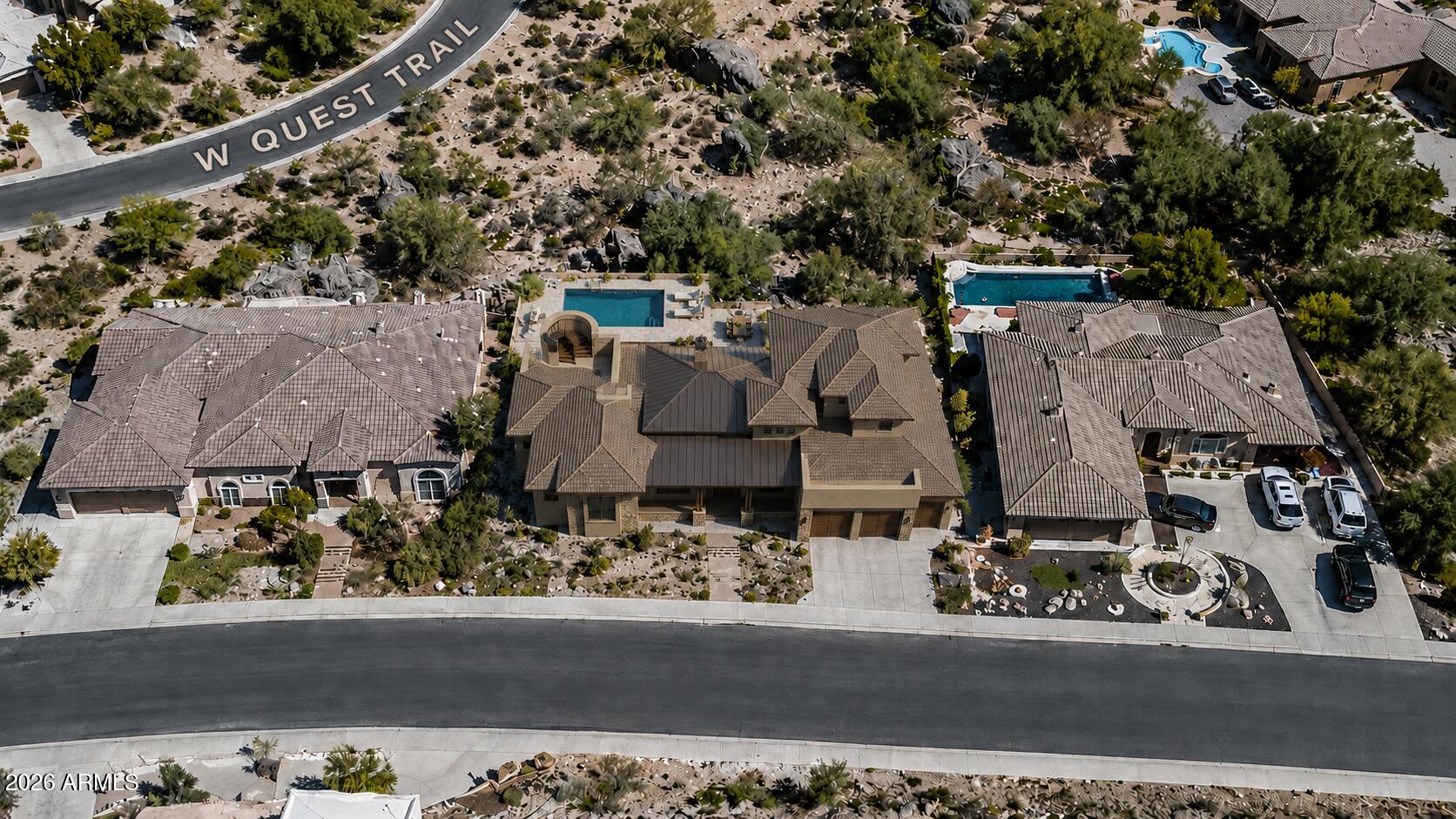 6136 West Alameda Road, Unit 7 Glendale, AZ 85310 - Photo 13 of 16 an aerial view of a house with a yard and large trees