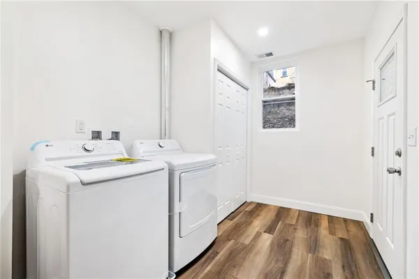 a utility room with dryer and washer